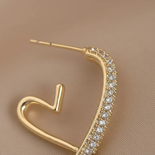 Boucle d'oreilles en or serti d'argent en forme de coeur ouvert
