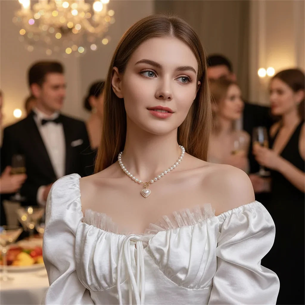 Collier de perle avec un pendentif en coeur