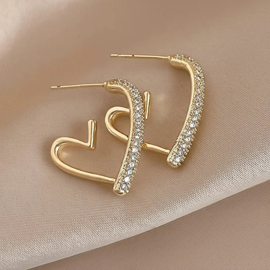 Boucle d'oreilles en or serti d'argent en forme de coeur ouvert